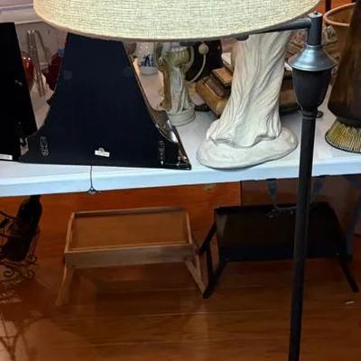 Sleek Black Swing Arm Floor Lamp with Neutral Fabric Drum Shade