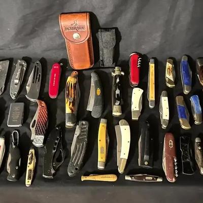 Large Knife Collection Featuring Folding Knives and Swiss Army–Style Multi-Tools