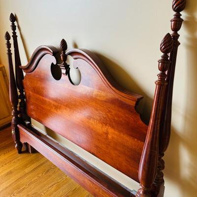 Beautiful cherry bed has double slots to accommodate either a full OR queen size mattress. 