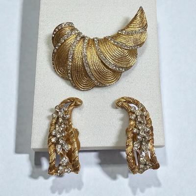 Kramer pin complementing earrings