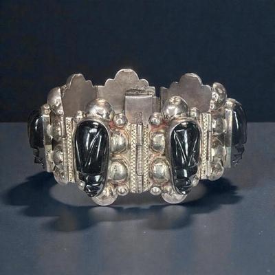 Mexican silver cuff with black onyx masks