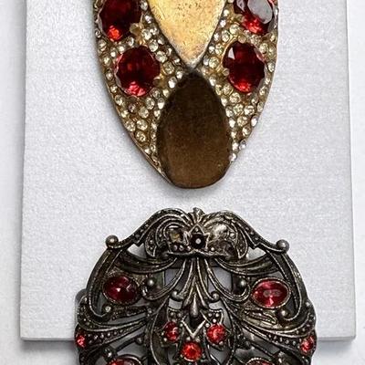 Two vintage coat clips