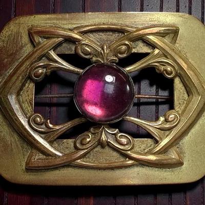 Victorian sash pin with purple cabochon