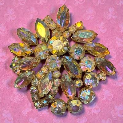 Gold tone aurora borealis rhinestone brooch