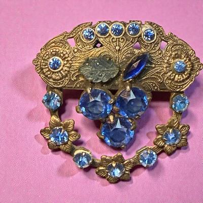Filigree floral pin with blue crystals