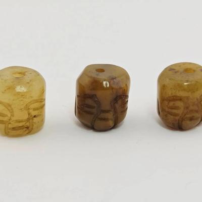 Chinese Small Carved Bead Trio