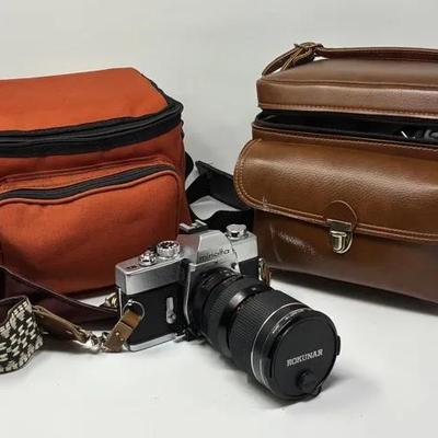 Minolta SR-T 201 Camera and Camera Bags of Additional Lenses