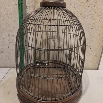 Large dome-top birdcage with a wooden base 