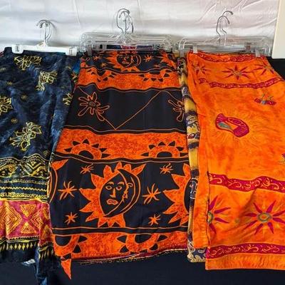 Wrap skirts, size small/medium. Full length featuring sun, moon, and floral motifs. 