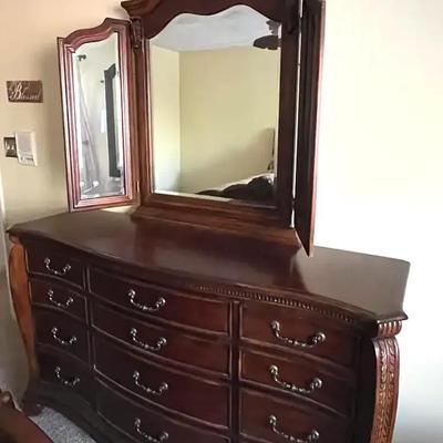 Ornate Wooden Dresser with Folding Beveled Mirror Panels