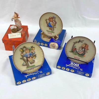 Hummelgoebel and boxes washing day and 76 78 annual plates