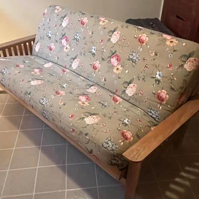 Solid Wood Futon With a Foral-Patterned Mattress 