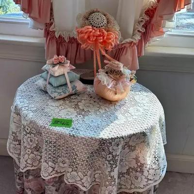 Lot 626:  Solid Wood Round Table With Salmon Colored Decor