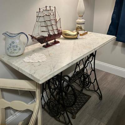 Sale Photo Thumbnail #181: Pair of marble top and solid iron base Singer sewing tables. 