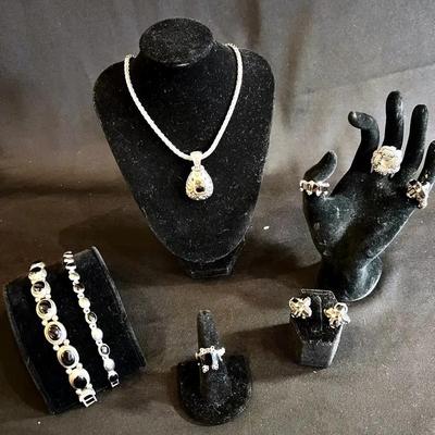 Sterling silver rings & studs with silver and gold tone pendant necklace
