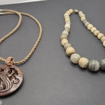 Coconut Shell Pendant On A Brown Braided Cord Necklace Plus