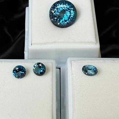 DM133 - Four London Blue Topaz Faceted Stones - 12ct, 2.0ct, 2.0ct, 0.95ct