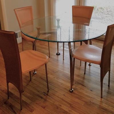 Leather chairs and glass table