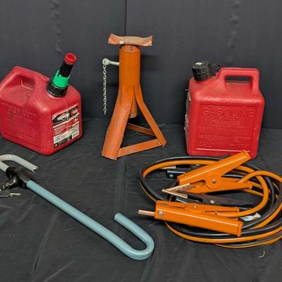 Automotive Emergency and Maintenance Accessories Lot with Gas Cans, Jack Stand, Jump Cables, and Loc