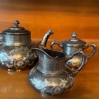 James W. Tufts Quadruple Plate Teapot, Creamer And Sugar Bowl