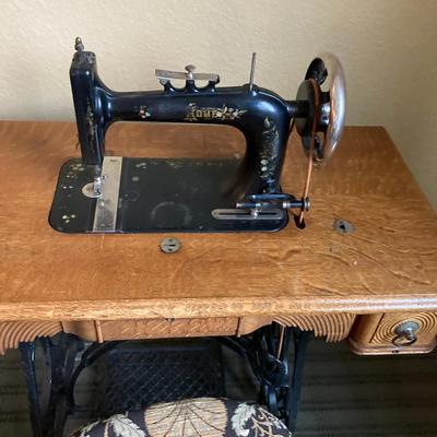 Antique New Home Treadle Sewing Machine in Oak Cabinet with Accessories