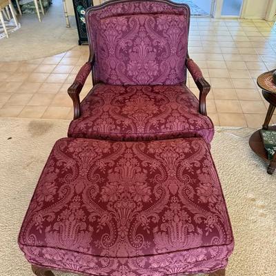 Traditional Upholstered Lounge Chair with Matching Ottoman in Burgundy Damask Fabric and Carved Wood