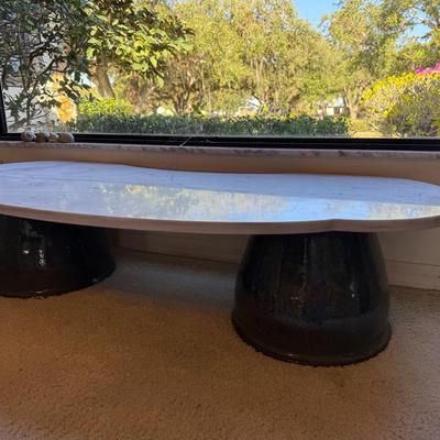 Modern Sculptural Coffee Table with Oval Stone Top and Dual Pedestal Bases