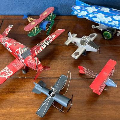 Schylling Stealth Zeppelin Tin Wind Up Blimp, Hand Made Coca Cola Plane, And Assorted Toy Planes