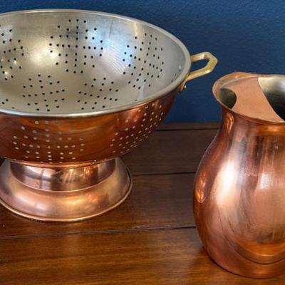 Copper And Brass Footed Colander And A Copper Pitcher With Brass Handle