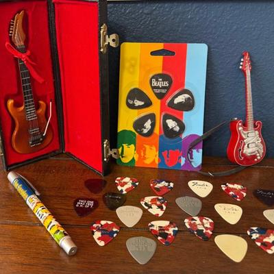 (2) Miniature Guitars, Beatles Guitar Picks NIP, Fender Thin And Medium Picks, And Jim Dunlop Picks, And More