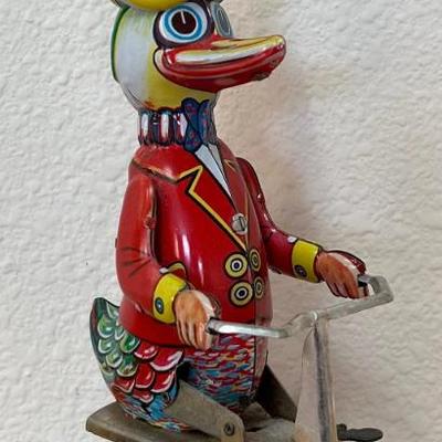 Vintage Tin Litho Windup Duck On Bike Toy With Key