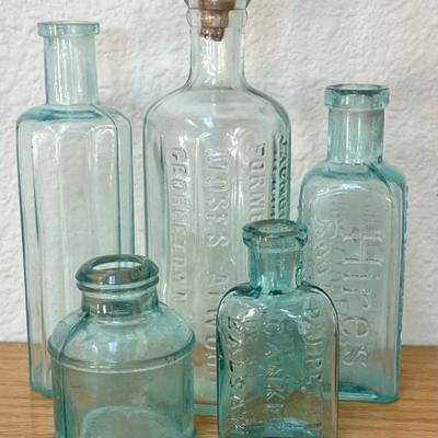 (5) Small Antique Glass Bottles - Atwood's Bitters, Hires Root Beer, Carter's, And D & J Pettits Balsam
