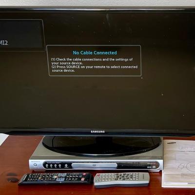 Samsung 32" TV And A Magnavox DVD Player With Remotes, Power Cables, Manuals, And RCA Cables