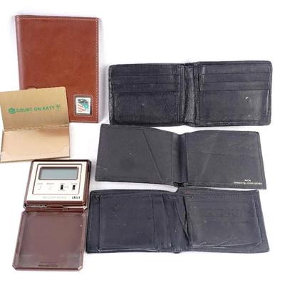 Vintage collection of men's leather accessories featuring a decorative solid brass business card hol