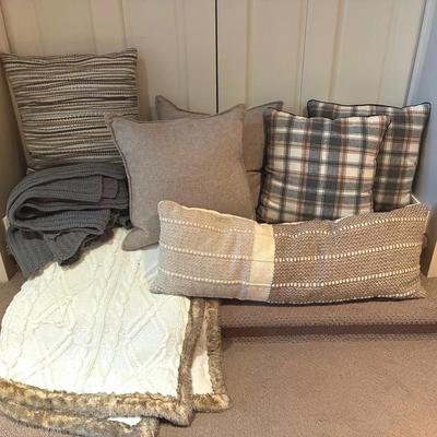 Neutral decorative pillows and throw blankets
