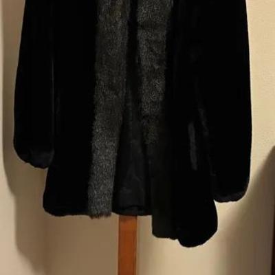 Hall tree and faux fur coat