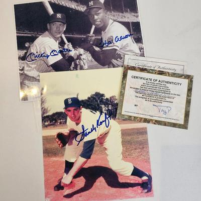 Lot #30 - Impressive autographed baseball photo lot featuring legendary players Hank Aaron, Mickey Mantle, Sandy Koufax.