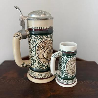 310: Avon Handcrafted Brazilian Beer Stein with Pewter Lid and Matching Mini Mug Set  This decorativ