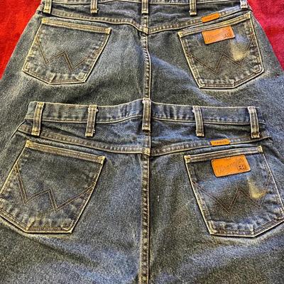 Two pair of FR Wrangler jeans in blue denim wash. 