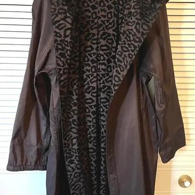 Custom made Hooded trench coat with a leopard interior print, pockets and a belt. 