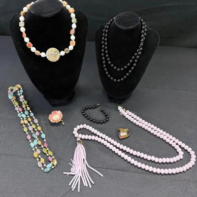 Vintage jewelry lot featuring a signed Miriam Haskell beaded necklace, along with additional costume