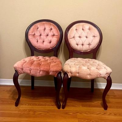 Two Victorian-style balloon-back parlor chairs with tufted rose upholstery