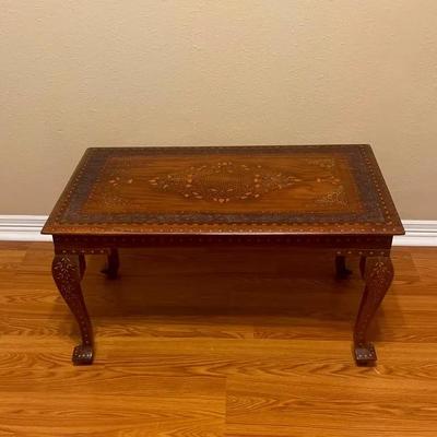 Hand-carved and inlaid wood coffee table