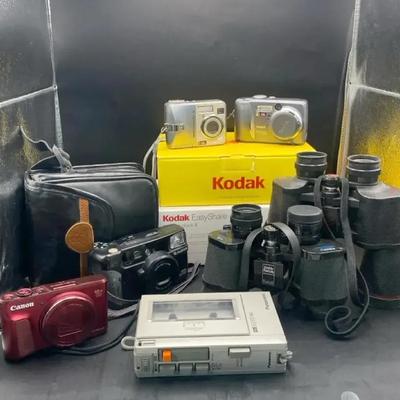 Collection Of Cameras Binoculars And A Cassette Recorder 
