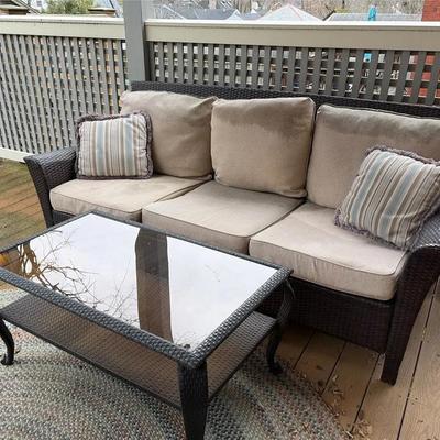 Outdoor Woven Vinyl Sofa And Glass And Vinyl Coffee Table 