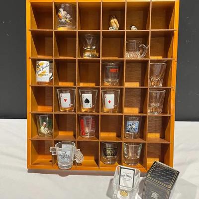 Assorted Shot Glass Collection In Wooden Display Cabinet