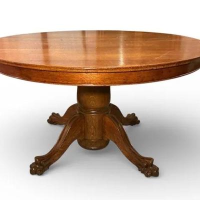 Tiger Oak Claw Foot Pedestal Dining Table with Four Leaves