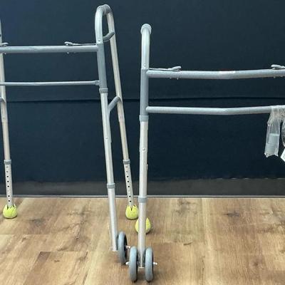 A Pair Of Aluminum Folding Walkers