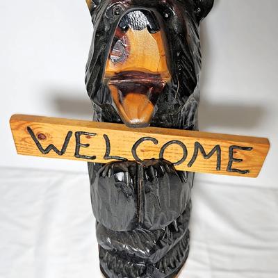 Wood-Carved Bear with Signs