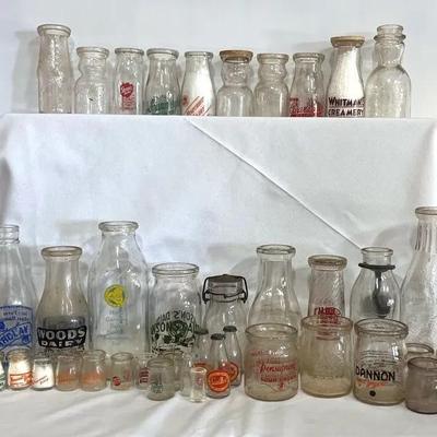 Collection of Vintage Milk Bottles and Various Collectibles